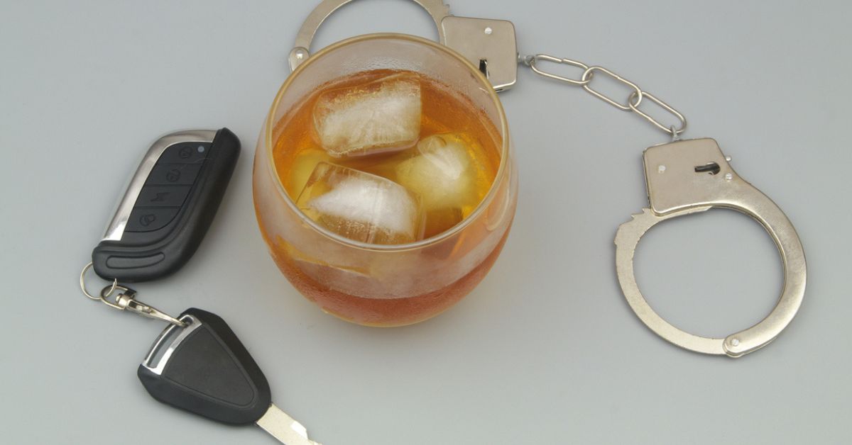 Handcuffs, keys, and liquor