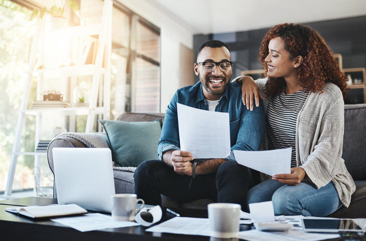happy couple reviewing documents