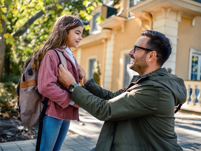 father dropping off daughter at school